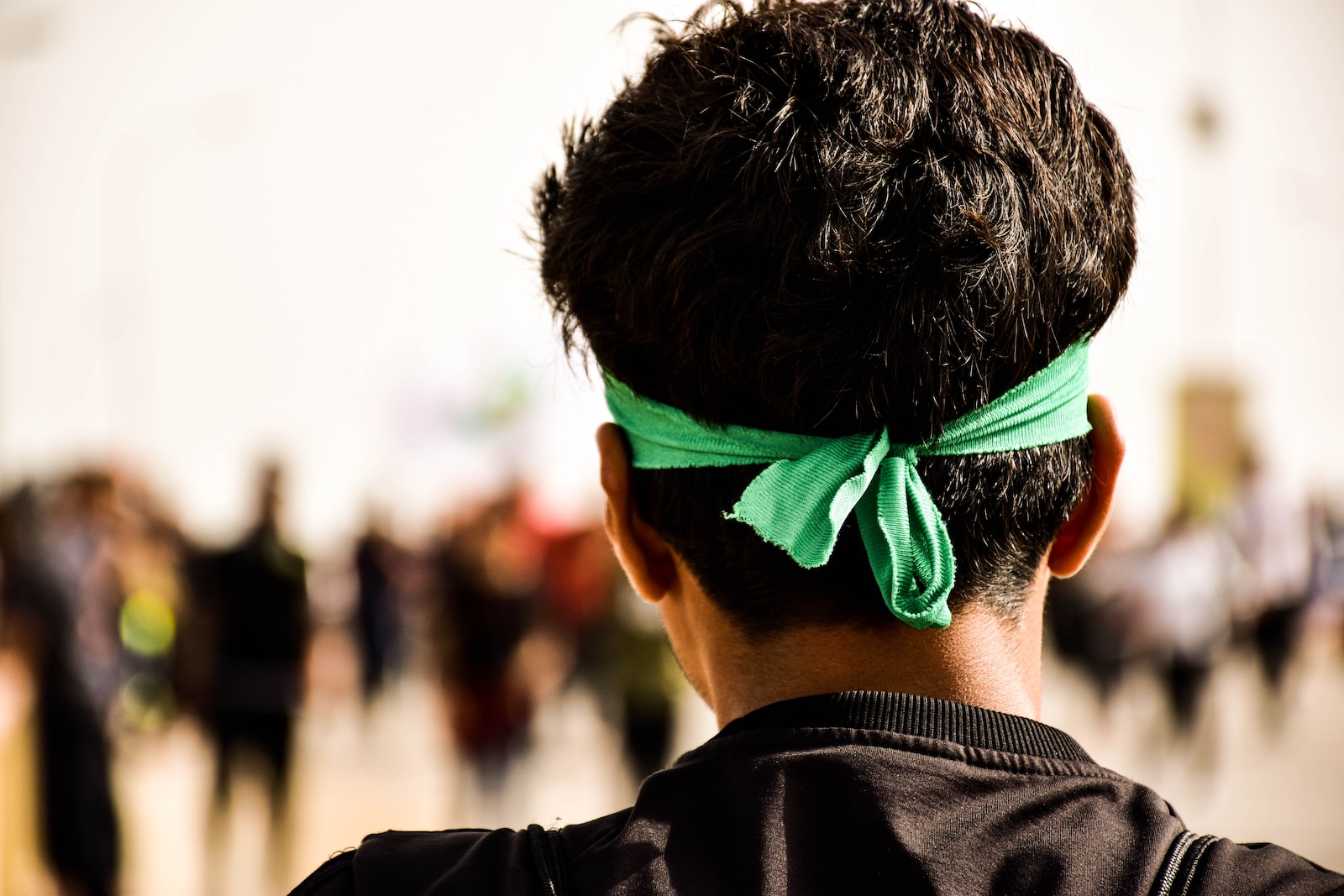 man in green headband